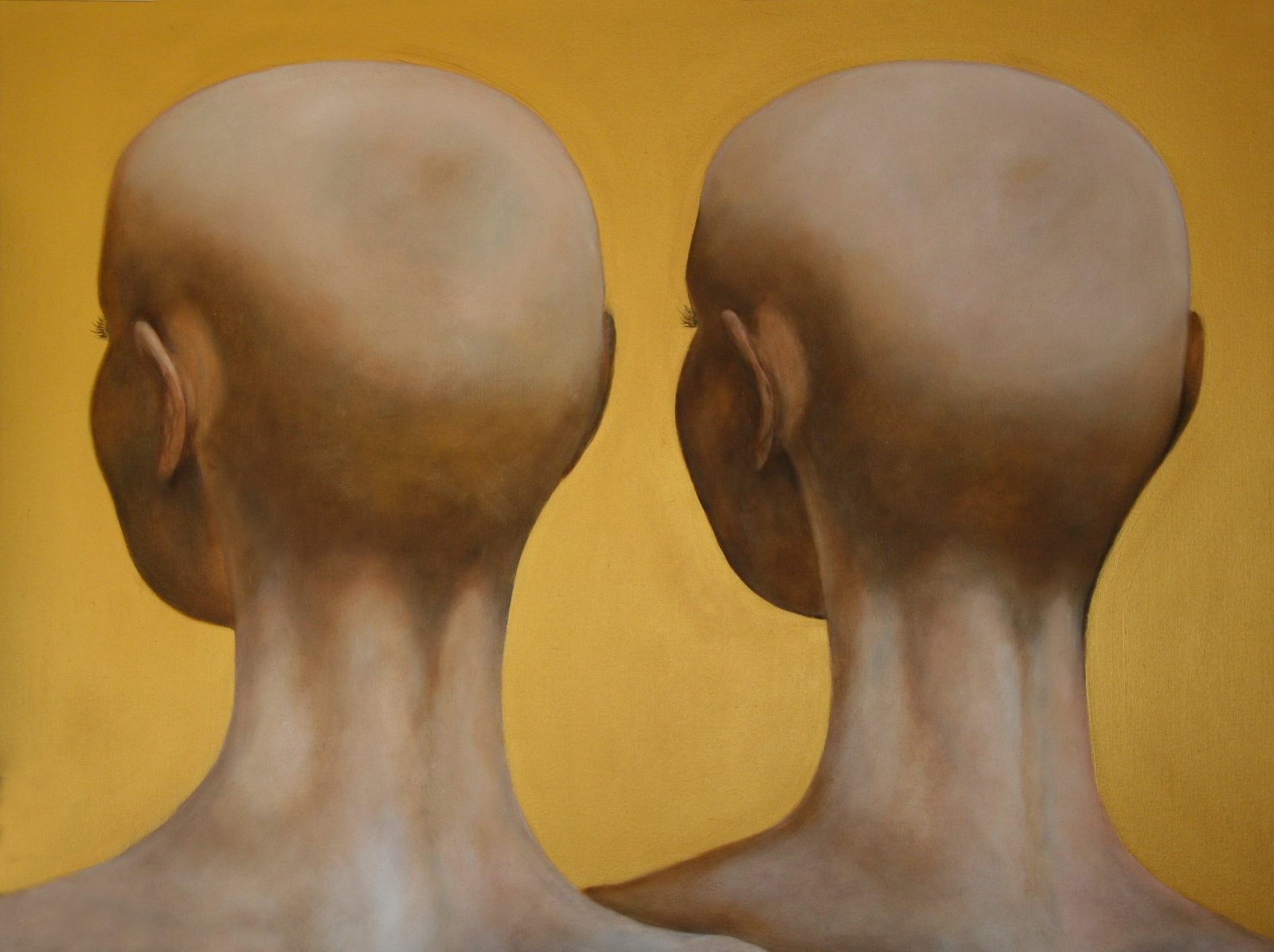 Two shaven heads seen from behind, side by side and turned slightly away from each other, glowing softly against a warm gold ground.
